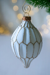 New Year 2026: champagne and Christmas tree decorations on the table.