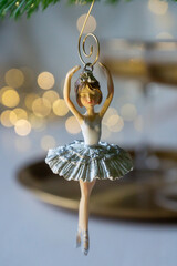 New Year 2026: champagne and Christmas tree decorations on the table.