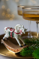 New Year 2026: champagne and Christmas tree decorations on the table.