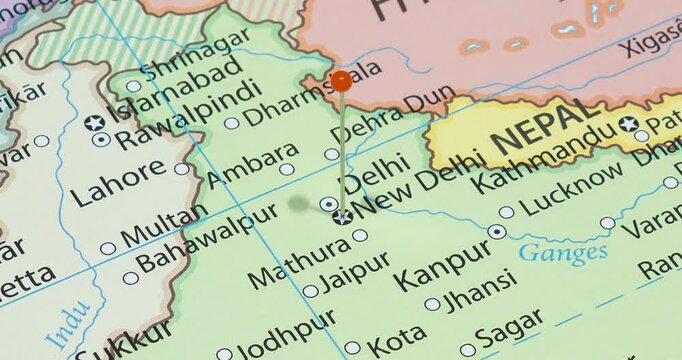 A zoom out of an orange pin into new delhi city of India political map