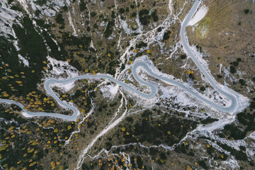 Mountain Road - Dolomites National Park Italy - Alpine landscape with mountains and pine trees in autumn fall summer - panoramic aerial view