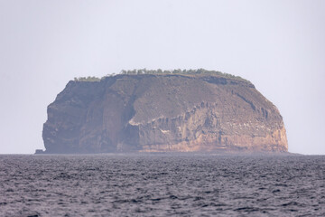 Daphne Minor Island seen from the water on the way from Santa Cruz to Bartolome Island