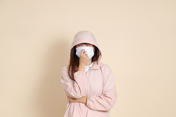 20s Asian woman in pink UV jacket