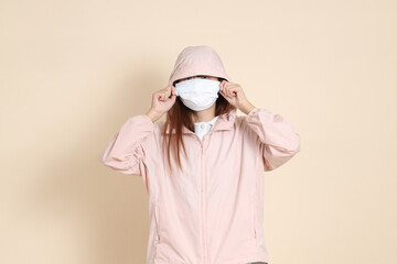 20s Asian woman in pink UV jacket