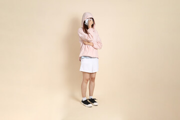 20s Asian woman in pink UV jacket