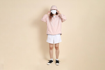 20s Asian woman in pink UV jacket