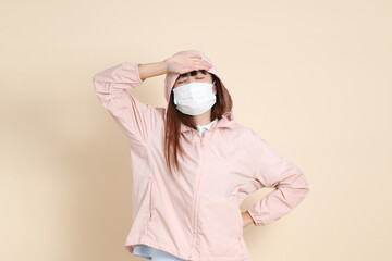 20s Asian woman in pink UV jacket