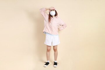 20s Asian woman in pink UV jacket