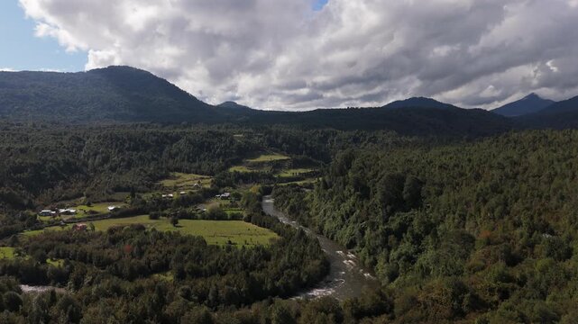 Panoramic Aerial View of Forest Valley with Centered River and Mountains