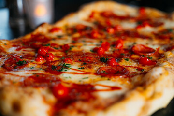 A large pizza with red pepperoni and cheese