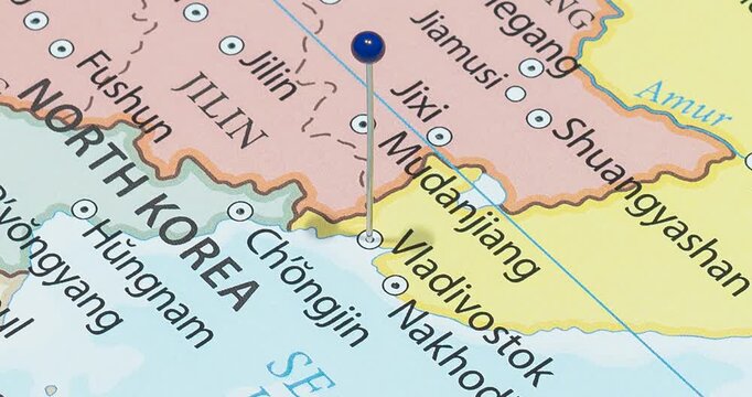 A zoom out of a blue pin into vladivostok city of russia political map