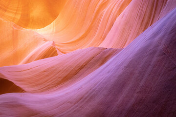 Fototapeta premium Stunning Sandstone Formations of Antelope Canyon with Vibrant Orange and Purple Tones