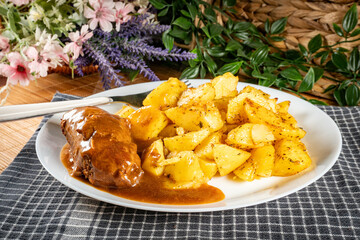 Beef roulade with baked potatoes.