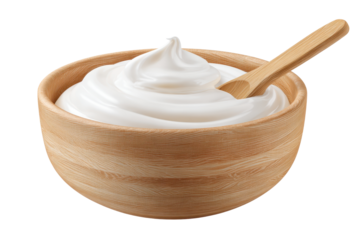 Creamy yogurt in a wooden bowl with a wooden spoon placed inside, ready for serving or eating at any time of the day
