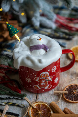 New Year's treats on the table and the symbol of the new 2026: a horse, tea, coffee, gingerbread and zephyr.