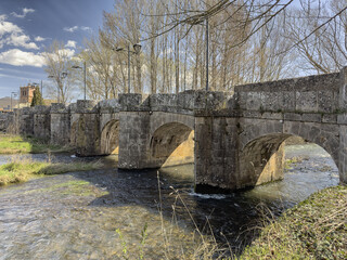 Medieval stone bridge over the Pisuerga River in Salinas del Pisuerga