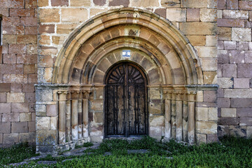 Romanesque doorway of San Bartolome Church in Bustillo de Santullan, Palencia