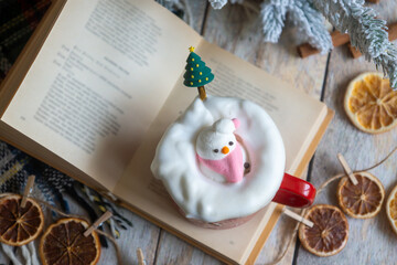 New Year's treats on the table and the symbol of the new 2026: a horse, tea, coffee, gingerbread and zephyr.