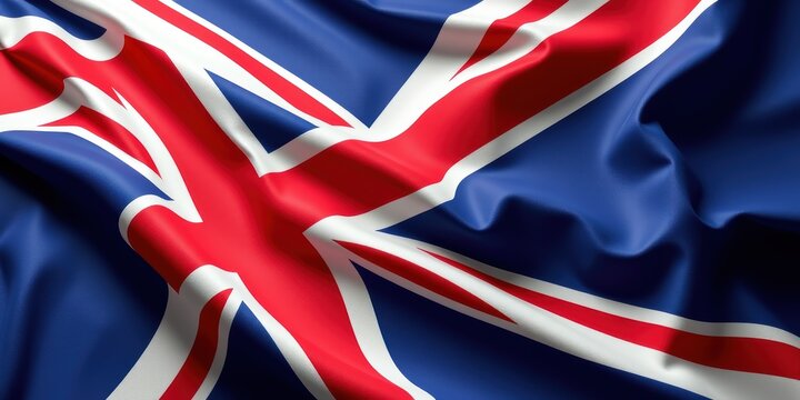 The Union Jack flag of the United Kingdom waving in the wind with its iconic red white and blue colors on display