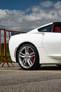 Chevrolet Corvette C7 rear quarter panel and alloy wheel, White convertible sports car profile