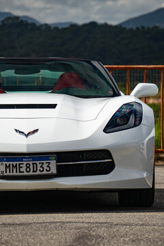 White Chevrolet Corvette C7 front nose and emblem, American sports car exterior detail