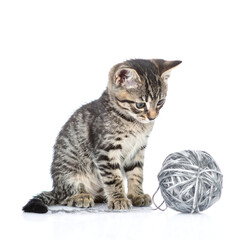 Curious Tabby Kitten with Grey Yarn Ball Isolated on White