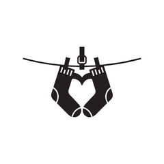 Vector illustration of black baby socks silhouette hanging on a clothesline like a travel icon against a sky background in a clean cartoon art design