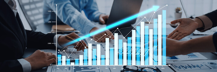 Business team engages in data analysis, utilizing charts and graphs for strategic planning and decision-making in a modern office environment, showcasing teamwork and collaboration. Scalp