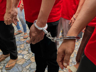 the prisoner's hands are handcuffed