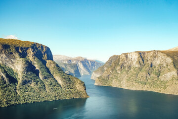 Fjord with mountains and clear sky in Norway