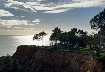 View of the sea and rocks of the beach of Olhos de Agua, Albufeira, Algarve, Portugal.