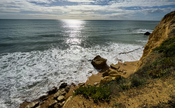 View of the sea and rocks of the beach of Olhos de Agua, Albufeira, Algarve, Portugal.