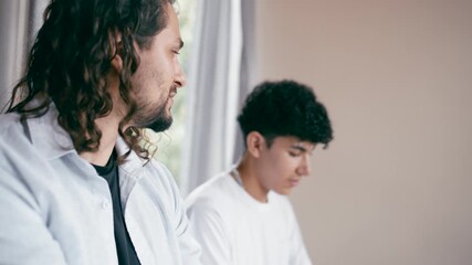 Young piano teacher with long hair instructing a teenage student during a private music lesson. Educational process of learning to play a musical instrument