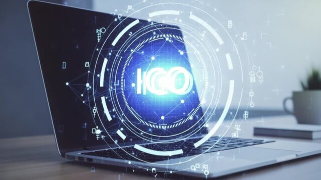 Laptop with glowing blue ico logo on screen in modern office setting with cup and books