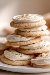 Stack of frosting cookies topped with cinnamon spice powder representing delicious sweet bakery dessert