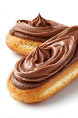Two chocolate eclairs displaying golden choux dough with rich dark chocolate cream swirls, a sweet french pastry