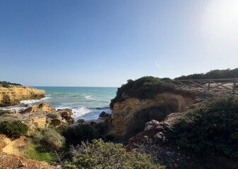 Obraz premium suggestive rocky coast praia albandeira beach in algarve, Porches Portugal
