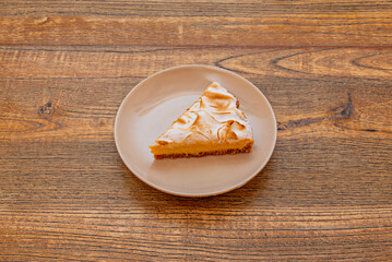 Mini lemon tarts in individual tartlet form, each with a shortcrust pastry base, lemon cream, and a...