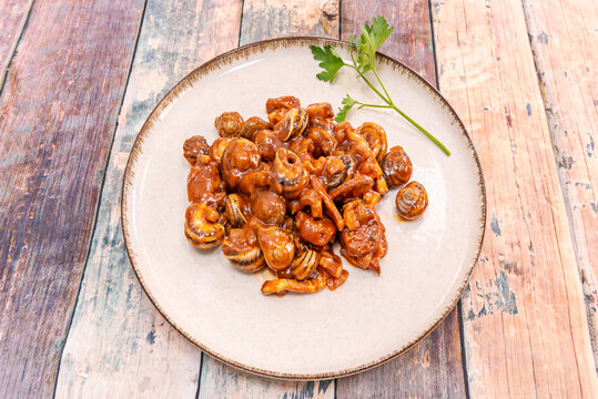Aromatic Snail Stew, with its Spiced Sauce and Herbs that Evoke the Most Ancient Flavors of Our Gastronomy"