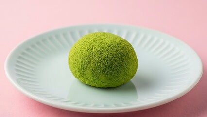 Mochi ice cream on a white plate against a pink background