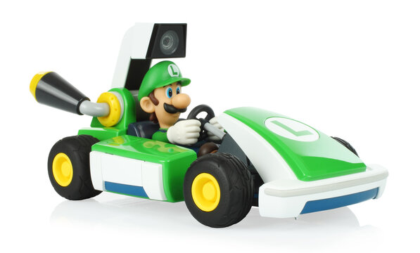 Mario Kart Live: Home Circuit is a Brand Mario Kart Game that combines Toys and Nintendo Switch with augmented reality. Toy Kart Luigi on transparent background with natural reflection and shadows