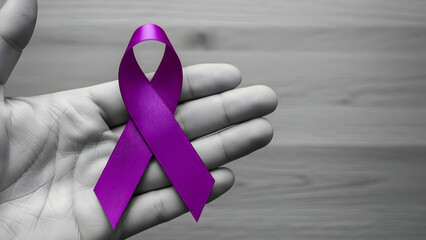 Holding purple ribbon for awareness campaign World cancer day 