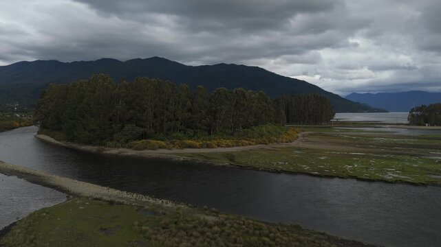 Aerial Panoramic View with Parallax Over Island River and Clouded Mountains