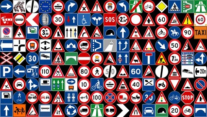 collection of colorful traffic and road signs on dark grid © ChiccoDodiFC