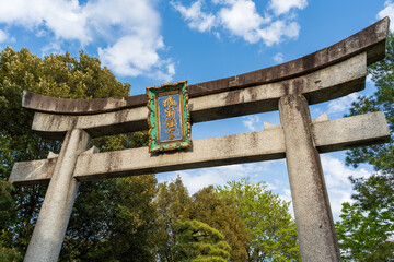Stone torii gate at the entrance approach to the historic Jonangu Shrine in Fushimi ward, Kyoto, Japan.