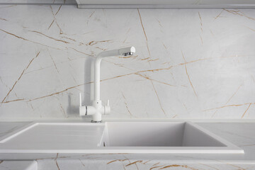 kitchen faucet on a stylish metal sink