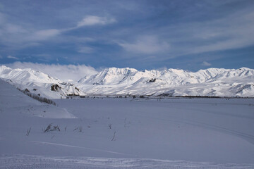 Sun shining on mountains on the Denali Highway in Alaska