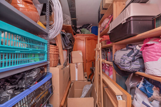 Storage room in urban housing completely full of junk and packing boxes