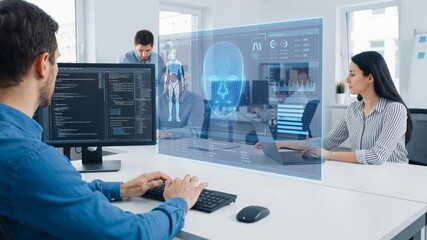 Computer scientists developing artificial intelligence in modern office. Holographic interface displaying facial recognition and biometric data analytics. Lockdown shot. - Powered by Adobe