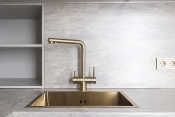 kitchen faucet on a stylish metal sink